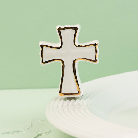 Cross-shaped mini on a light green background